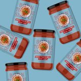 Jars of Harry's Famous Rustic Tomato Basil sauce on a blue background
